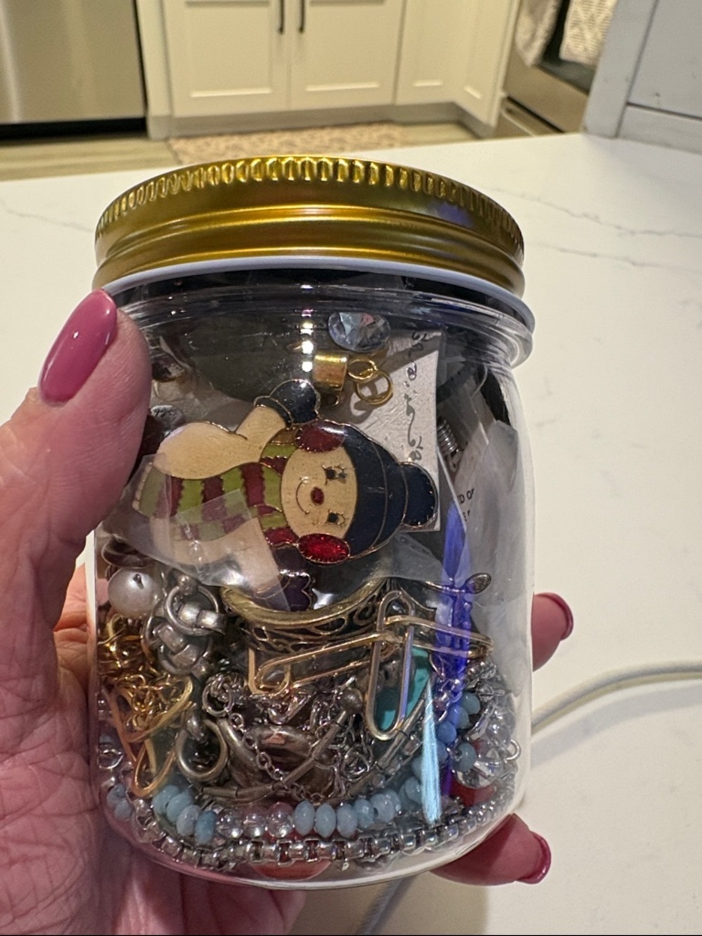 Gold-Lid Jar of Mixed Jewelry Charms Q